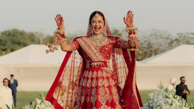 Bride Meera seen in red lehenga for her big day